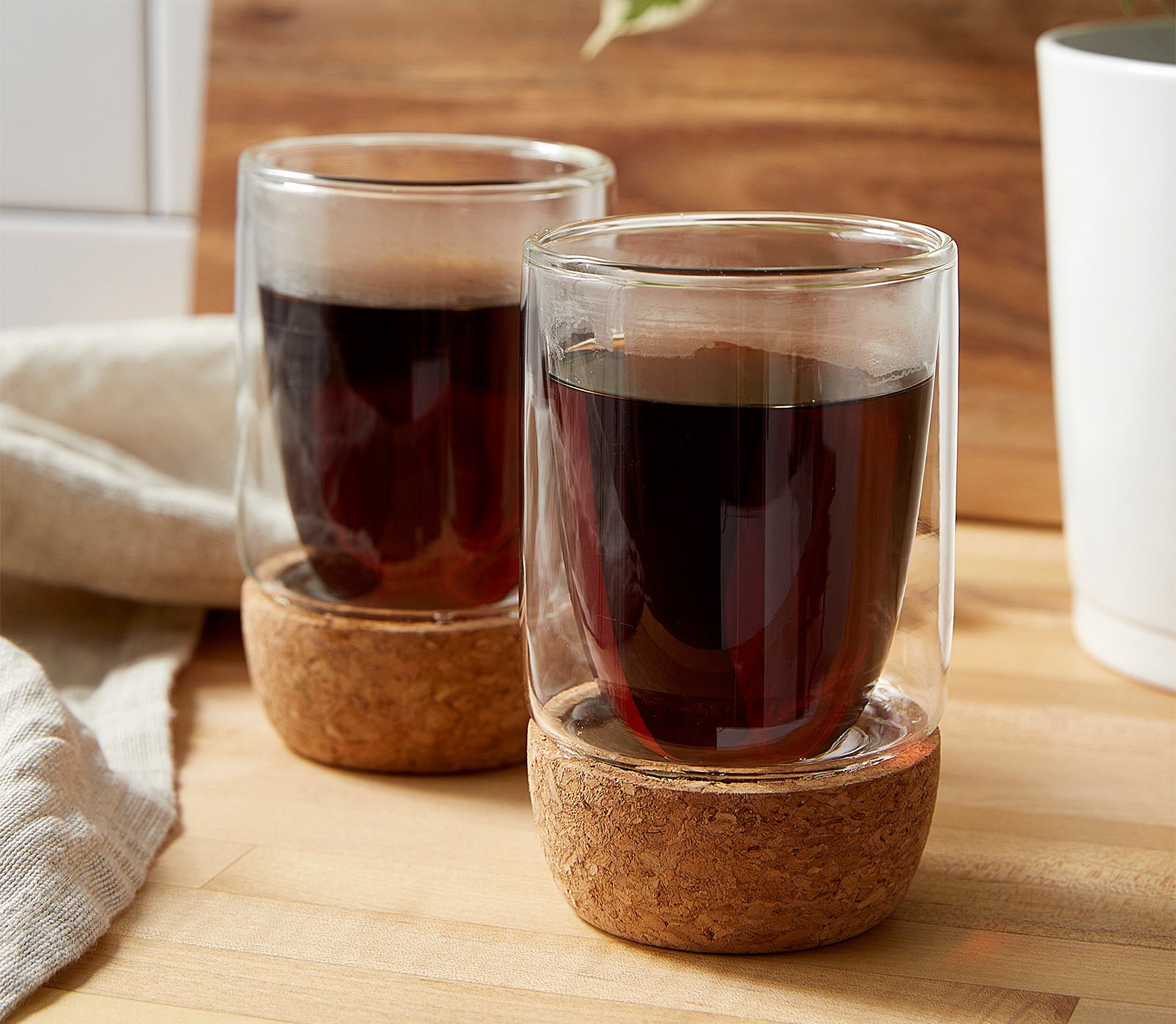 Two small glass cups filled with coffee