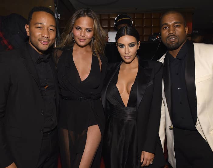 Chrissy poses with husband John Legend, Kim, and Kanye at an event