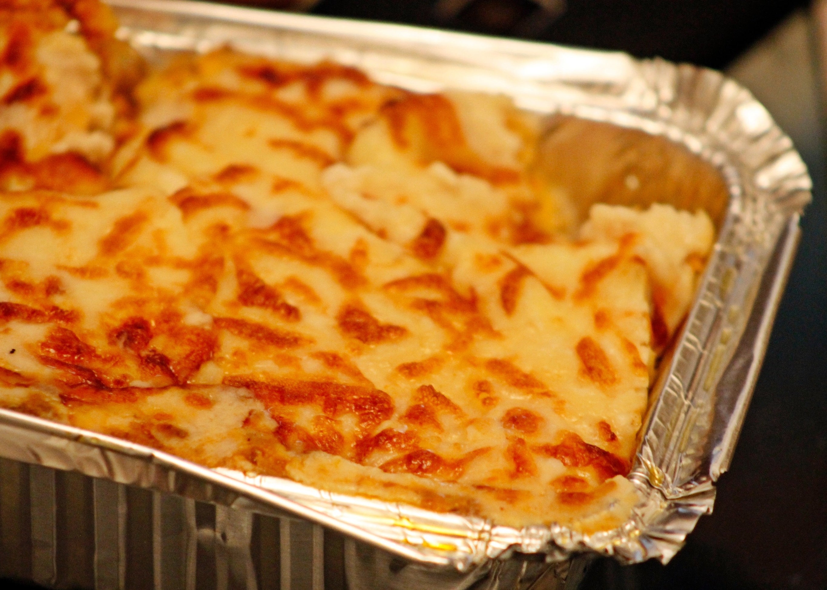 A lasagne in a foil container