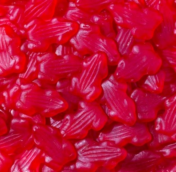 A pile of red frog lollies