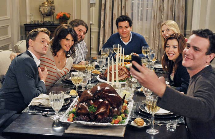 The cast of How I Met Your Mother at Thanksgiving dinner