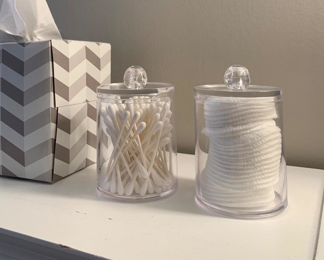 reviewer photo showing the two jars with q-tips in one and cotton rounds in the other