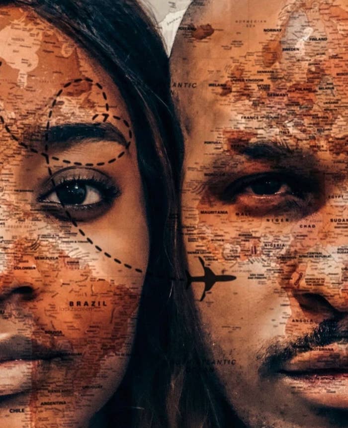 Two models with maps drawn over their faces