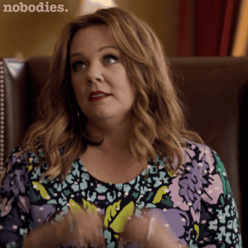 gif of actress melissa mccarthy making a heart with her hands