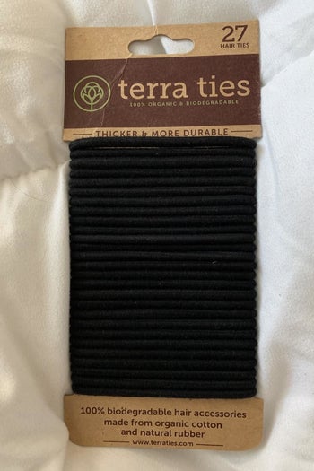 a reviewer photo of a pack of black hair ties