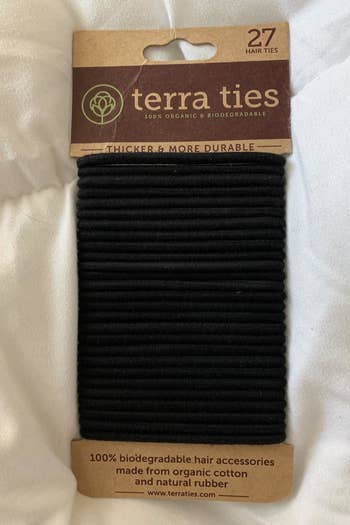 a reviewer photo of a pack of black hair ties 