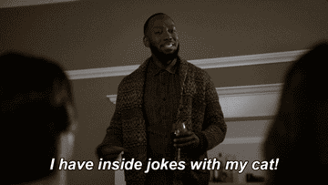 Gif of Winston from New Girl saying &quot;I have inside jokes with my cat!&quot;
