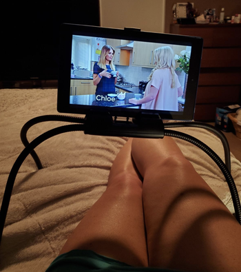 reviewer image of ipad attached and resting on bed