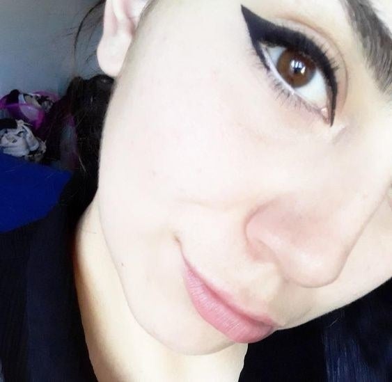 Reviewer wearing the bold winged eyeliner in black