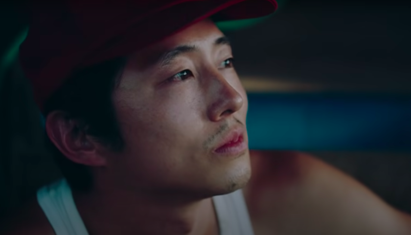 Steven Yeun looking out in &quot;Minari&quot;