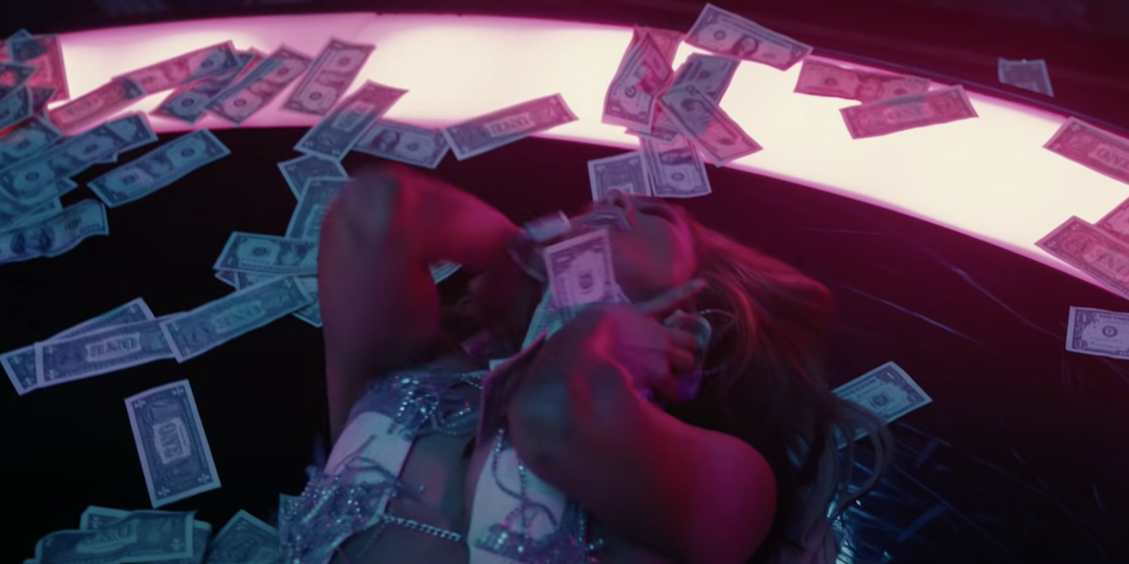 Jennifer Lopez&#x27;s &quot;Hustlers&quot; character rolling around in money 