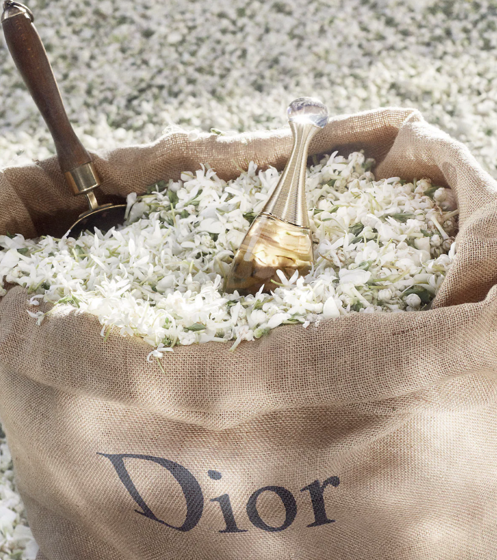 the dior bottle in a sack of flowers