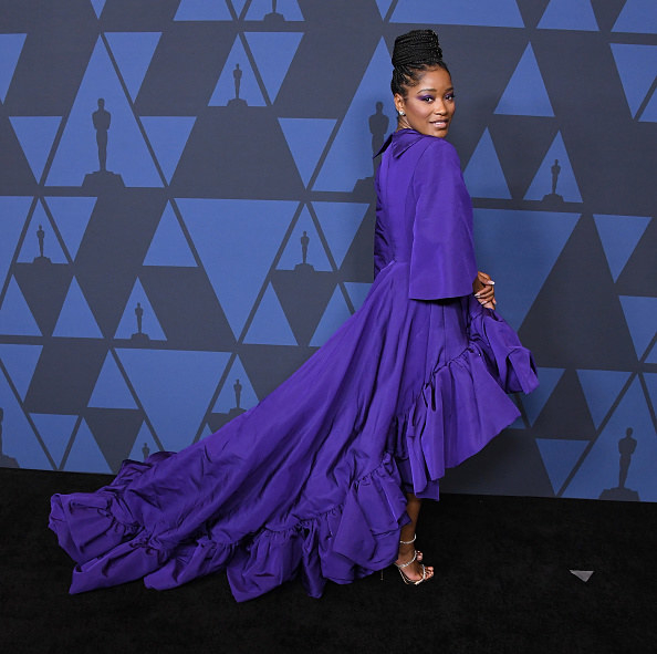 Keke wearing a hi-lo gown on the Oscars red carpet