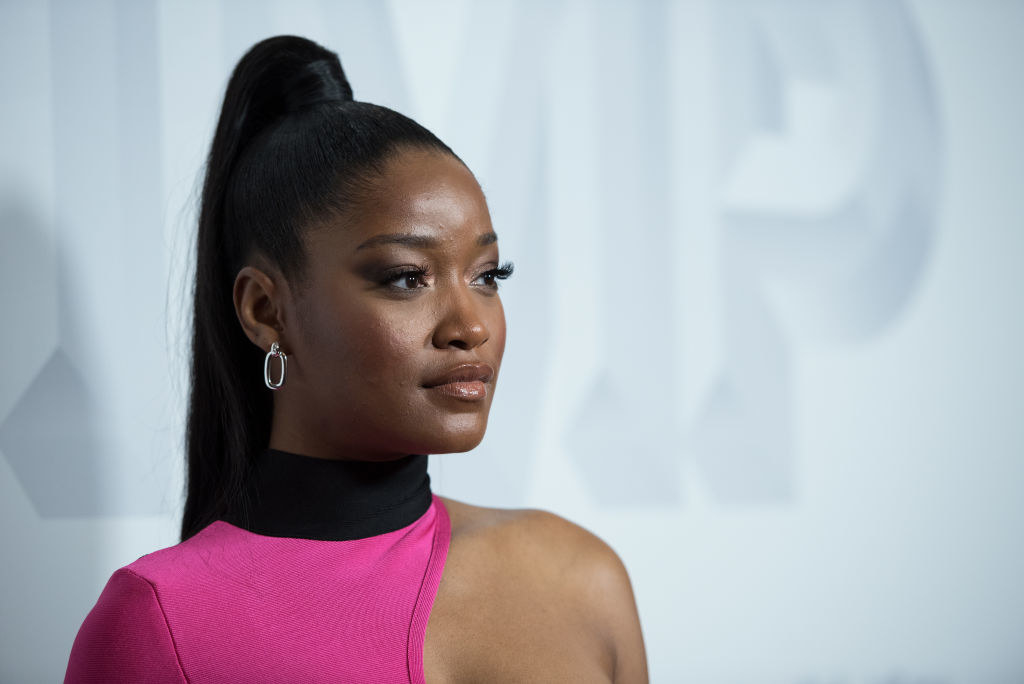 Keke rocking a high ponytail on a red carpet