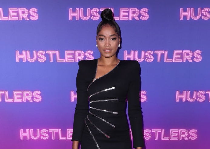 Keke wearing a gown with multiple faux zippers across the body at an event for her movie Hustlers