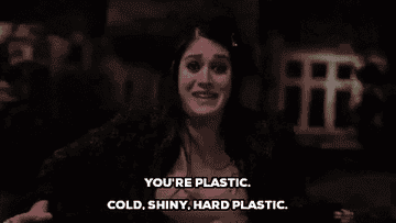 a gif of Janis in &quot;Mean Girls&quot; yelling &quot;you&#x27;re plastic. cold, shiny, hard, plastic&quot;