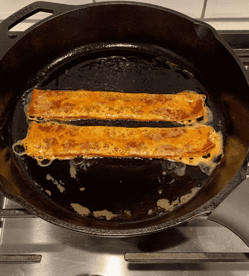 GIF of bacon sizzling in a skillet