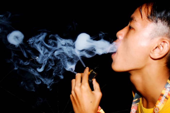 Person exhaling smoke