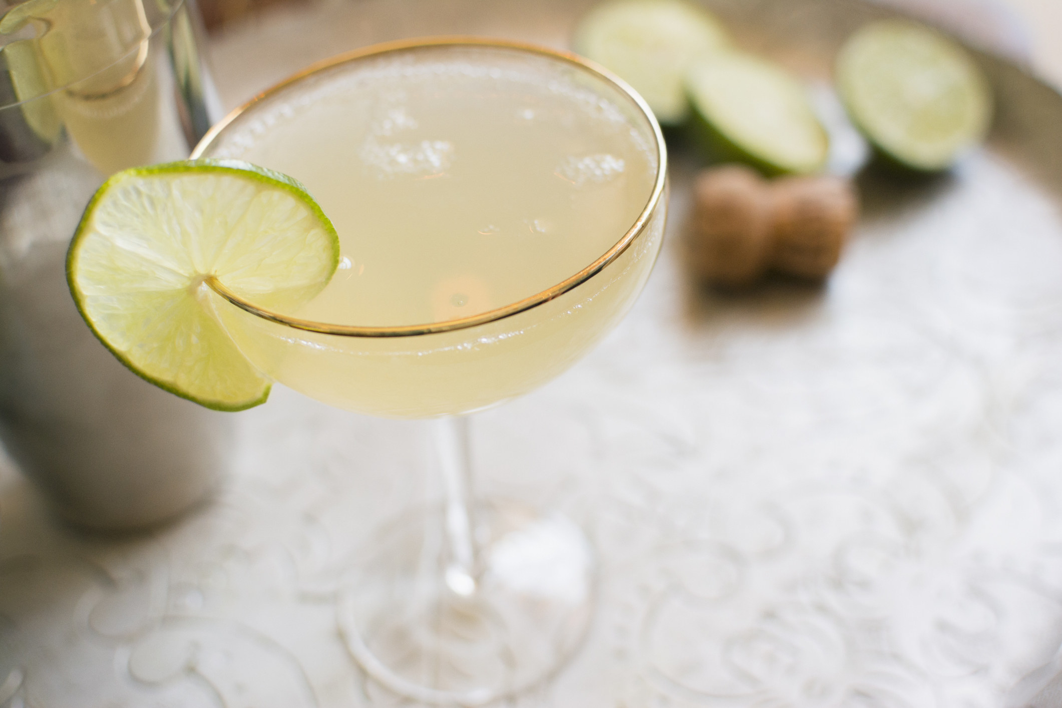 A lime daiquiri in a coupe.