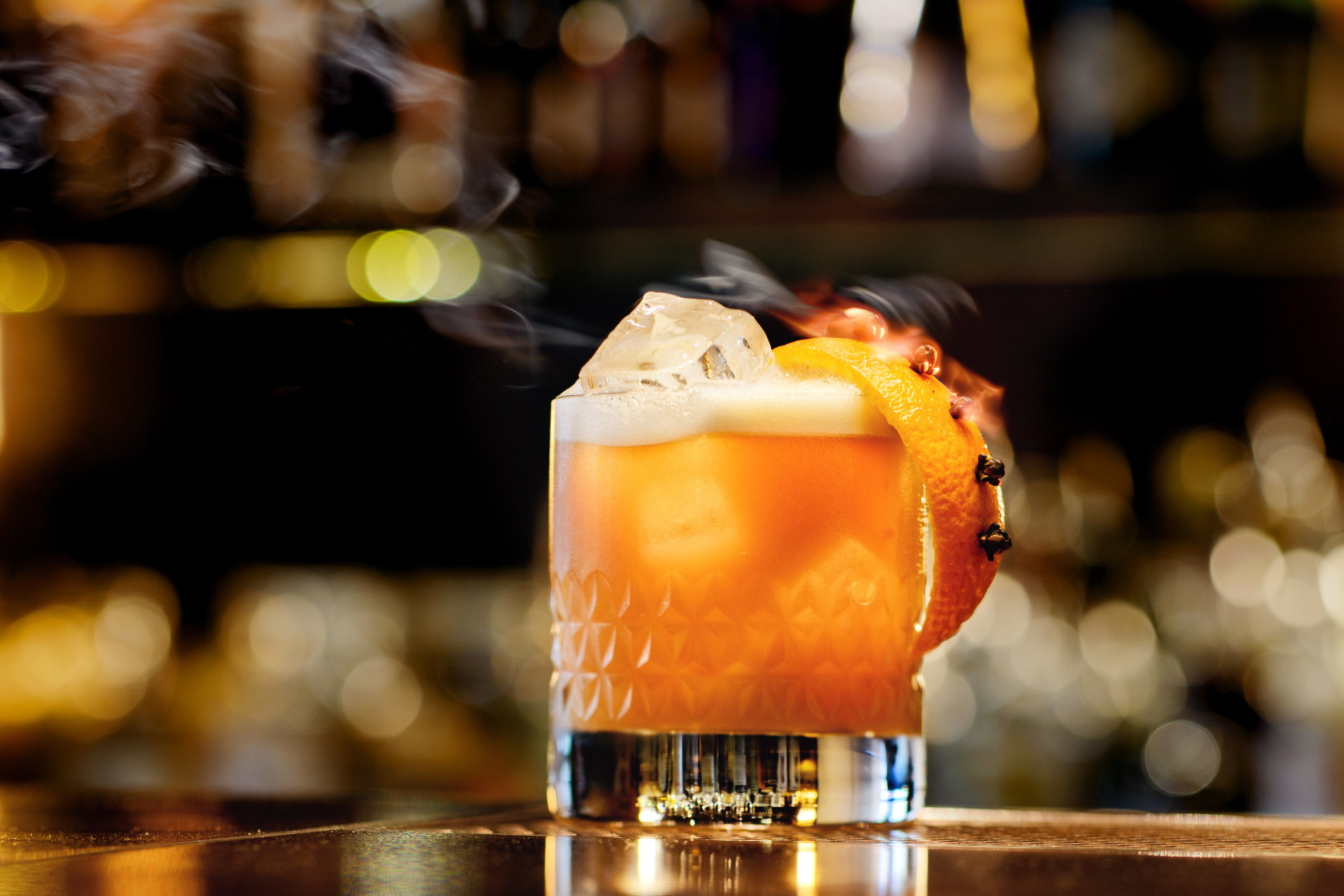 A whiskey sour on a cocktail bar.