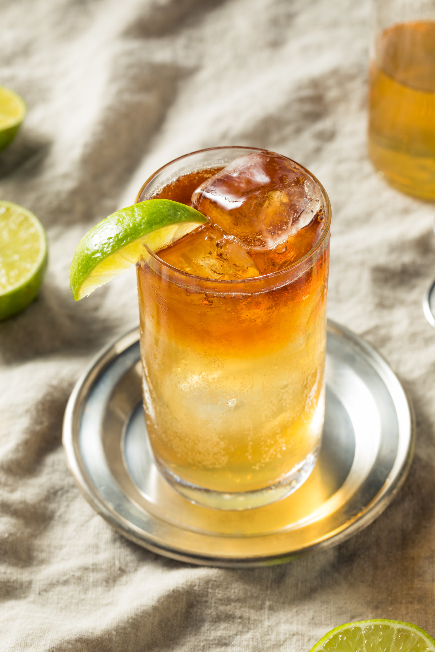 A dark and stormy cocktail with lime.