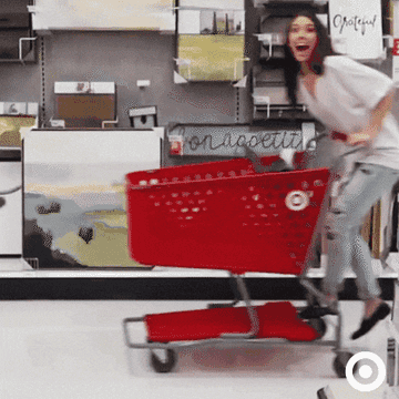 Model pushing Target cart in Target store