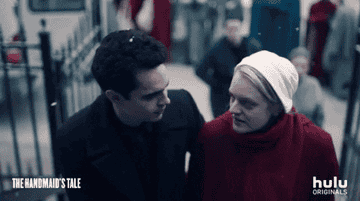 GIF of Nick and Offred walking 