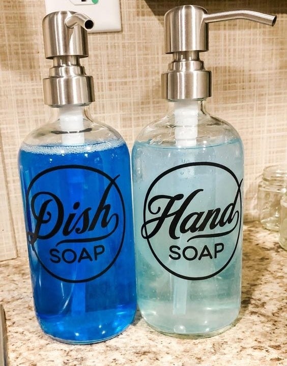 Reviewer&#x27;s picture of their labeled bottles for hand soap and dish soap
