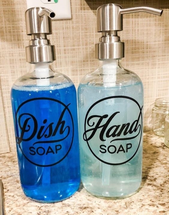 Reviewer&#x27;s picture of their labeled bottles for hand soap and dish soap