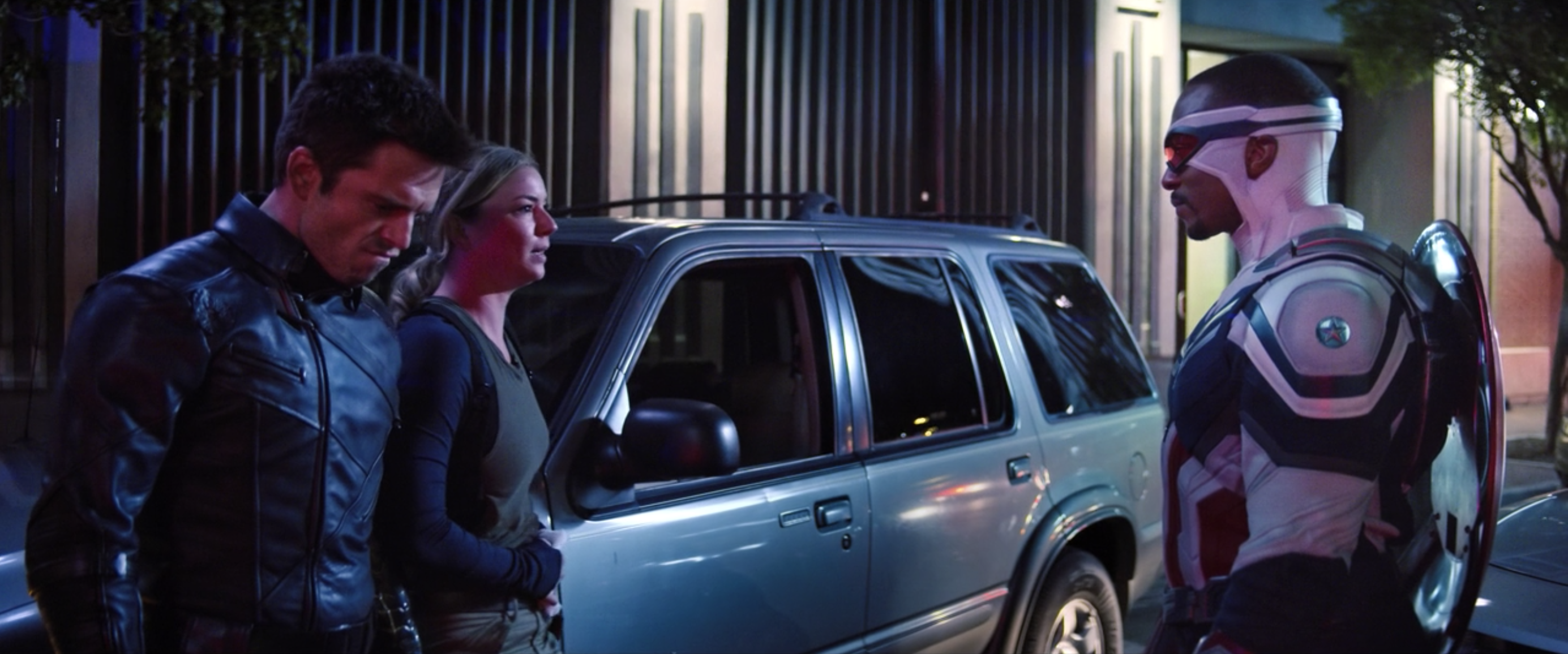 Bucky, Sharon, and Captain America stand by a car