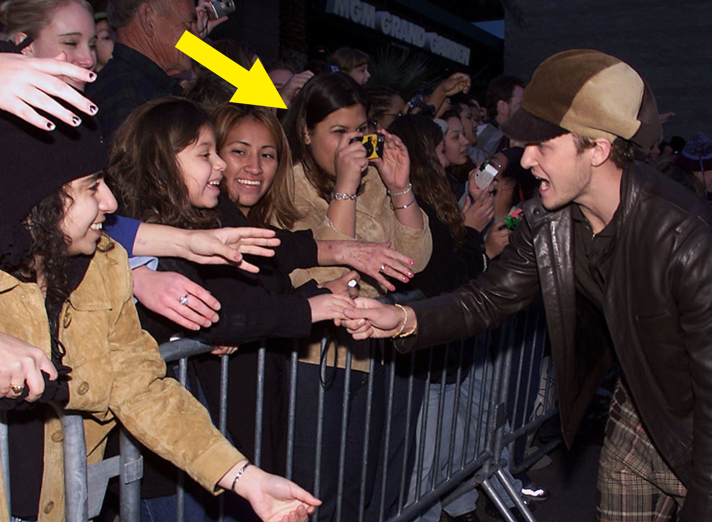 a girl taking a photo of jc chasez