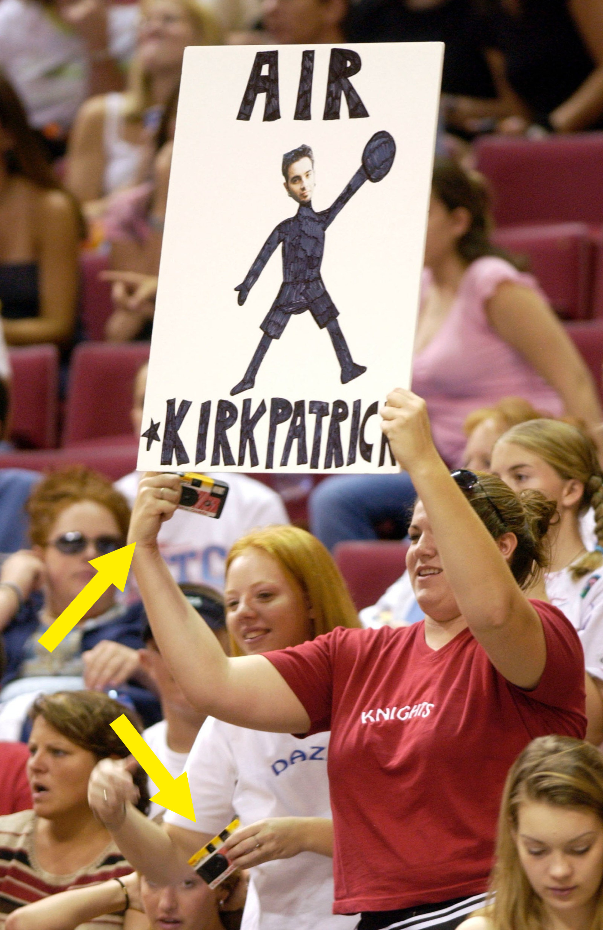 A girl with an air kirkpatrick sign