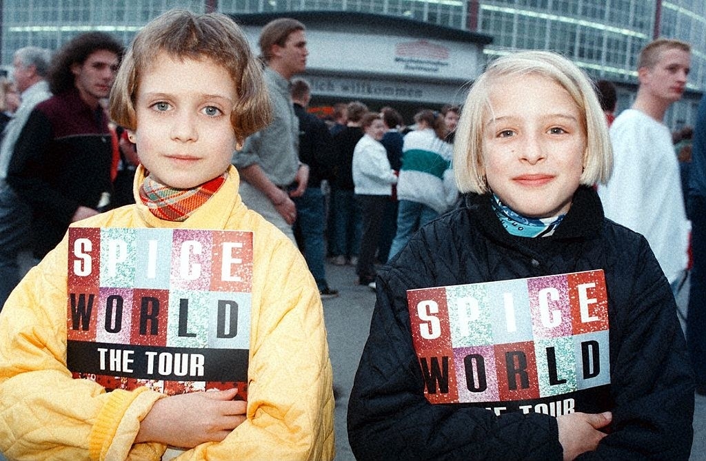 two girls holding spice girls books