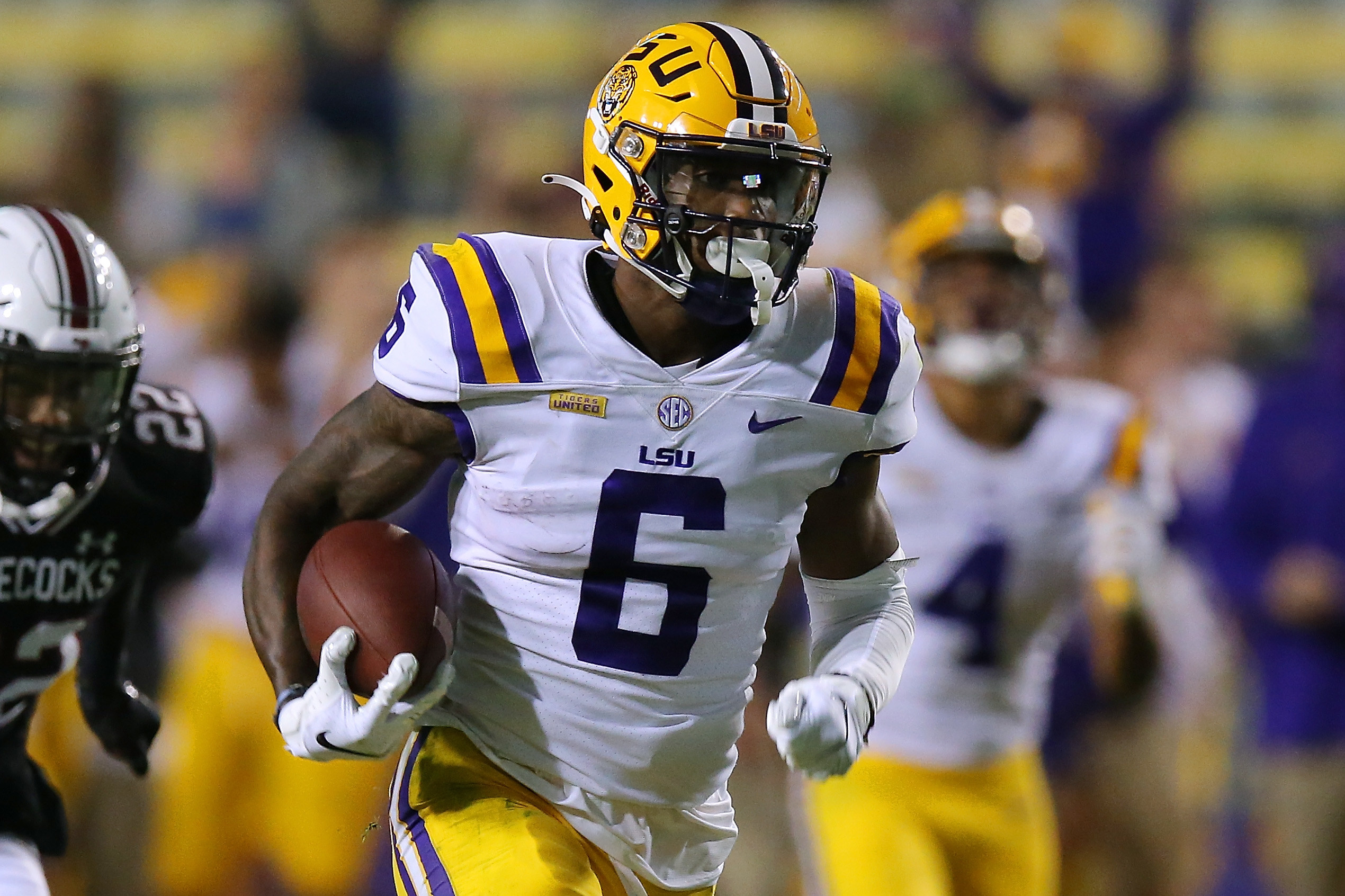 Terrace Marshall Jr. running with the football