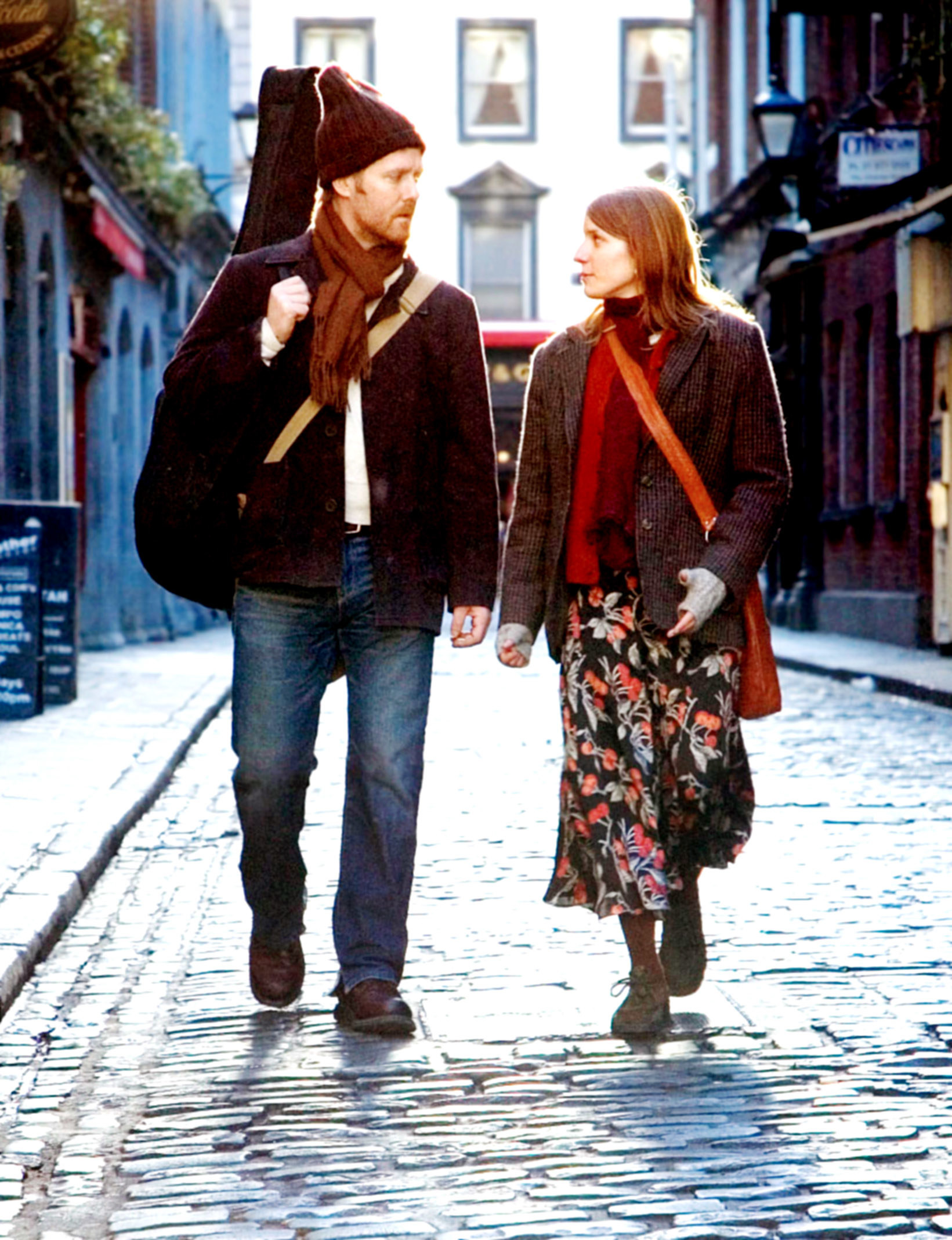 A man and woman walking down a Dublin street