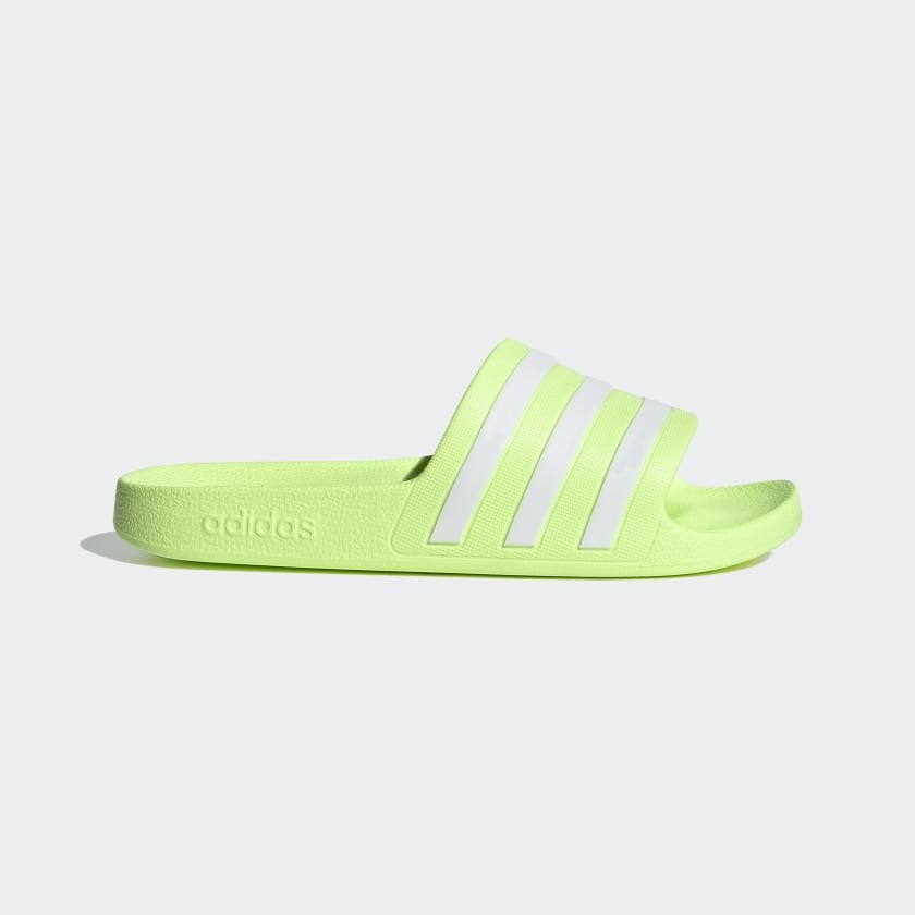 the slides in neon green with white stripes 