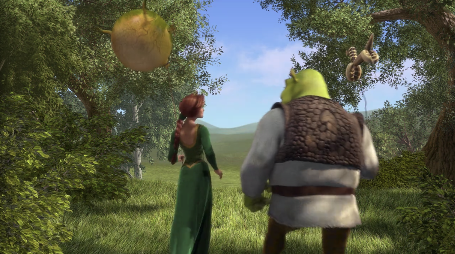 Shrek and Fiona walking shoulder-to-shoulder in the forest 
