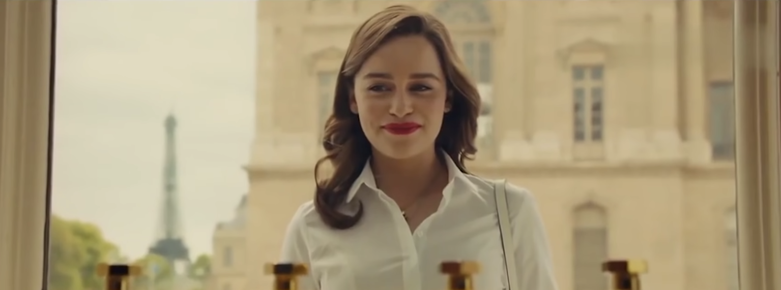 Woman smiling and looking into a window