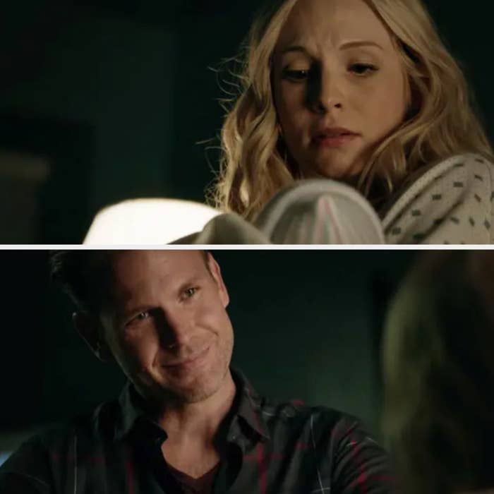 Alaric looks at Caroline fondly as she holds the babies