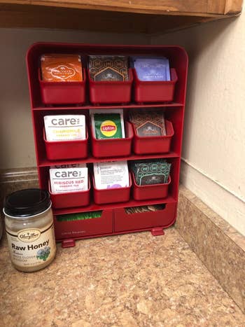 a reviewer photo of the tea bag organizer filled with tea bags