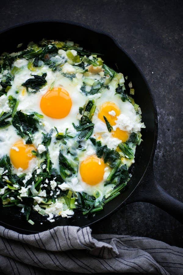 Skillet dandelion greens with baked eggs.