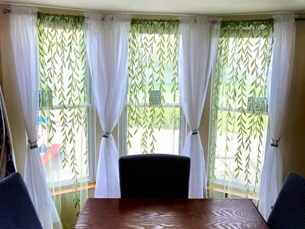 drapes hanging on three windows