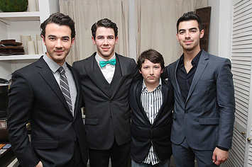 (L to R) Kevin Jonas, Nick Jonas, Frankie Jonas and Joe Jonas backstage after Nick Jonas' debut in "How To Succeed In Business Without Really Trying" on Broadway 