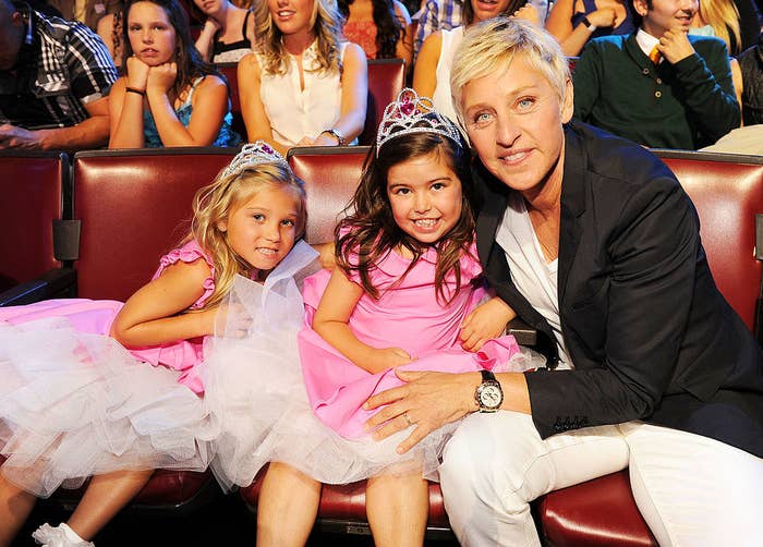 The two girls posing with Ellen at an awards show