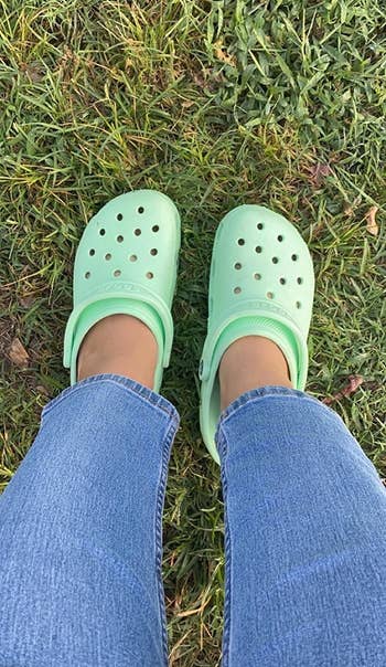 a different reviewer wearing seafoam green crocs