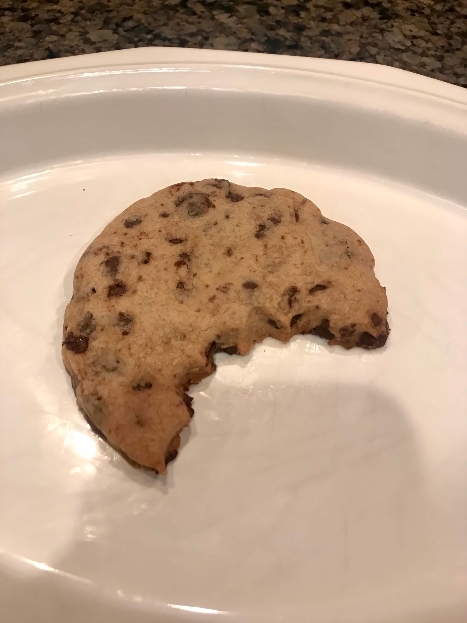 cookie that looks like someone ate half of it