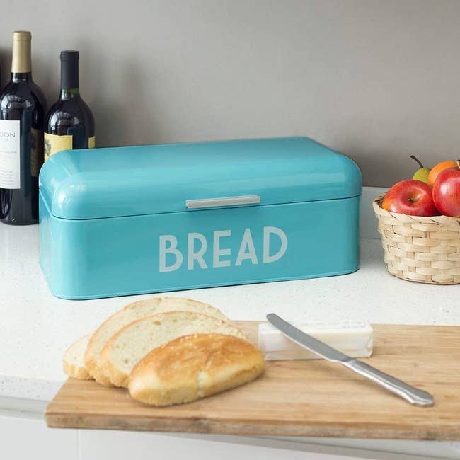 a turquoise rectangular box that says bread on it in white