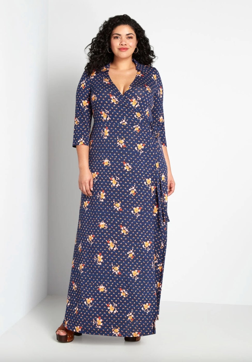 The long wrap dress in navy geo/floral being worn by a model
