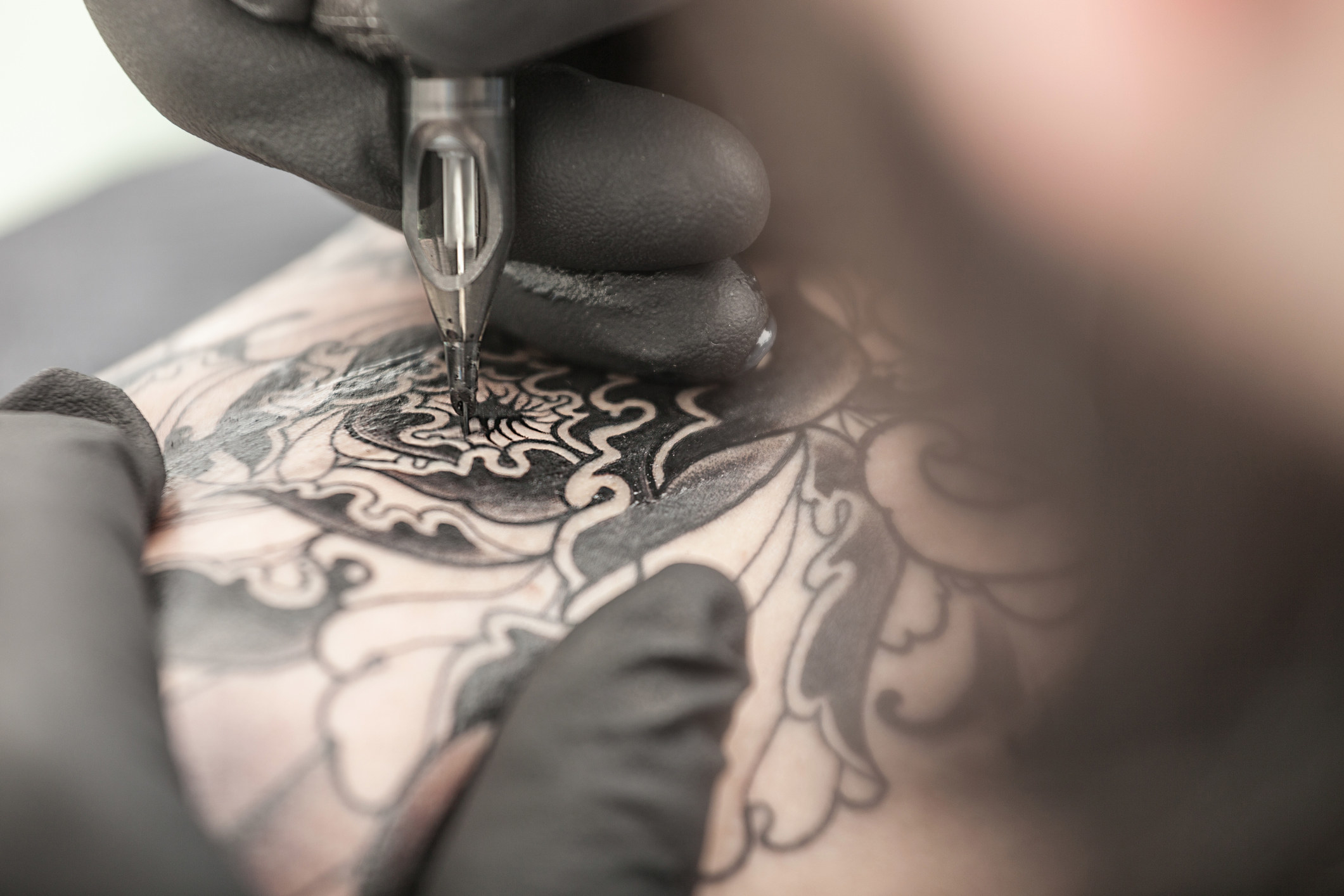 a tattoo being drawn