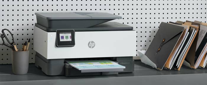 An HP printer sitting on a desk